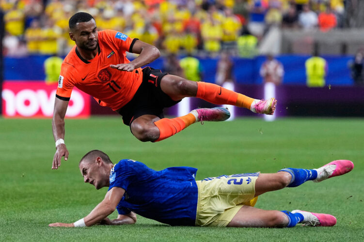 Brian Brobbey and the Dutch roll in the rain to a win over Tunisia to top World Cup Group F